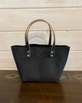 Buda Leather medium tote made from pebbled black top-grain leather with front pocket, stamped logo patch, and silver hardware.
